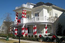 The balloon column is a classic party decoration that instantly elevates party décor. What Better Idea For White Columns Than To Turn Them Into Candy Canes Tucker Hill Christmas Column Decor Outdoor Christmas Decorations Christmas Columns