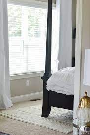 For a rug beside your bed, you can choose a thick sheepskin or a moroccan rug. Why Rugs Should Be Layered On Carpet Kelley Nan