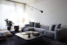 A minimalist building, object, or interior design is stripped to its core function, realized using limited materials, neutral colors, simple forms, and avoiding excess ornamentation to achieve a pure form of elegance. 20 Best Minimalist Living Rooms For Streamlined Design