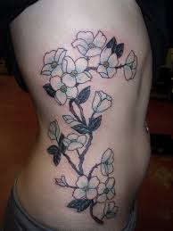 Some combine the dogwood flower with the dove which is a symbol of peace, hope and faith. Cool Pale Colored Dogwood Flower Tattoo On Side Tattooimages Biz