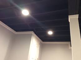 Styrofoam panels are some of the cheapest options out there for basement ceilings, and chances are you have been in quite a few basements that use these tiles for their ceiling coverings. A Blackout Ceiling Gives This Finished Basement A More Industrial Feel Industrial Blackout Ceiling Tiles Basement Basement Renovations Finishing Basement