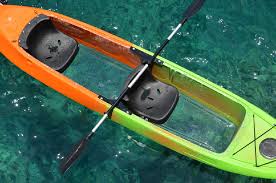 Family arriving to join our awesome led illuminated night kayak tour in glass bottom kayaks. Kayaking