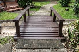 Gnomes wouldn't even be able to fit on them. Pathway And Wooden Small Bridge In Garden Stock Photo Picture And Royalty Free Image Image 61819954
