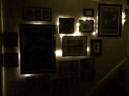 Gallery Wall Photos And Art Lit From Behind Small Warm Leds Attached To Exposed Pliable Coper Wire Not Finished Photo Wall Gallery Light Art Gallery Wall