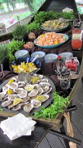 Seafood Buffet In A Canoe Seafood Buffet Seafood Dinner Oyster Roast Party