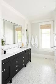 Because this vanity has two barn doors, you will need to purchase an extra set of barn door hangers. Black Washstand With Trough Sink And Two Wall Mount Faucets Transitional Bathroom