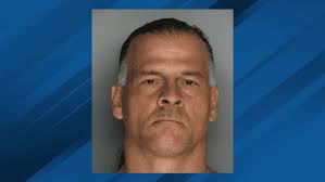 arrested for photographing pointing gun father child