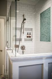 This decorative element was created as a protection for the newly made walls but soon became a piece of decoration. His And Hers Shower Niches Transitional Bathroom