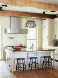 White cabinets make the space feel large and airy. Decorate A Farmhouse Kitchen Better Homes Gardens