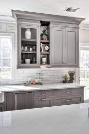Then with white cabinets many designers are going for white subway tile for the backsplash or a subtle color of glass if you are going grey tones, then you stick with more white granite and grey backsplash. 25 Ways To Style Grey Kitchen Cabinets