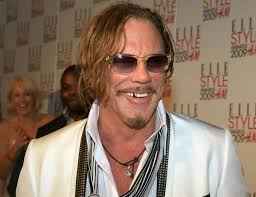 Mickey Rourke says 'there is a God' despite tragedy, suffering
