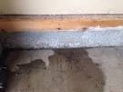 Water leaking into garage under wall