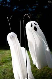 Easy Lighted Hanging Ghosts A Dollar Store Diy Hanging Ghosts Dollar Store Halloween Diy Halloween Props Diy