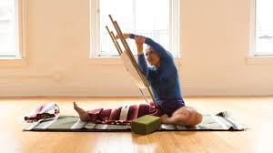 Find Your Most Grounded And Spacious Parivrtta Janu Sirsasana With A Chair Iyengar Yoga Yoga Shoulder Iyengar