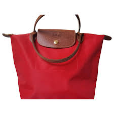 It gets tricky because there are so many different types of these fake totes out there with multiple modifications, and the design has become even more sophisticated throughout the years. Sacs A Main Longchamp Sac Pliage Rouge Longchamp Coton Rouge Ref 141905 Joli Closet