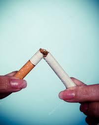 Addiction. Hands breaking cigarette. Quit smoking. Stock Photo by  ©Voyagerix 44043687