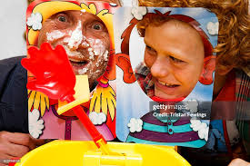 Alan Twigg and Archie Twigg play with the Pieface Showdown game as... News  Photo