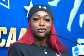 Florida Gators jumps coach Nic Petersen (right) talks with Asia Phillips  during practice prior to the NCAA Track and Field Championships at Hayward  Field. 66759683 Editorial Image