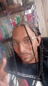 Rebranded my hair. I love how the tinsil makes the braids light up 👆