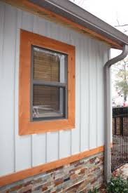 Modern Craftsman Exterior With Board And Batten Siding Ledger Stone And Cypress Tri Window Trim Exterior House Paint Exterior Exterior Paint Colors For House