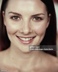 Young Woman Smiling Close Up Portrait High-Res Stock Photo