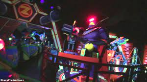 Visitors board an omnimover space vehicle featuring two laser pistols and a joystick. Buzz Lightyear Astro Blasters On Ride Disneyland Youtube