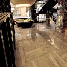 This type of flooring is engineered with 70% limestone and other resilient materials to be the perfect alternative to natural stone, porcelain or ceramic tile. China Petrified Wood Tile With Polished China Tiles Floor Tiles