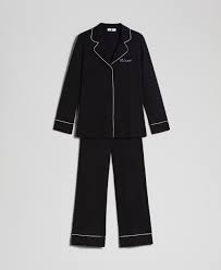 A narrow strip of cloth used to decorate the edges of clothes or furniture 2. Long Pyjamas With Contrasting Trims Woman Black Twinset Milano