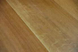 Transition area from kitchen to living space where herringbone rift and quartered white oak floor meets wide plank white oak rift and quartered floor. Rift And Quartered Project Tags Seneca Hardwood Lumber Co Inc