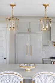 White And Blue Kitchen Inspiration Light Powder Blue Cabinets Gold Brass Hardware Drawer Handles P Kitchen Remodel Layout Kitchen Remodel Small Home Kitchens