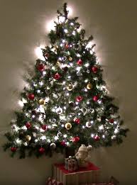 A Diy Wall Mounted Christmas Tree Is The Perfect Small Space Solution Wall Christmas Tree Wall Mounted Christmas Tree Flat Christmas Tree