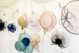 How To Hang Your Hats Ribbons And Pegs Are A Fun Way Of Providing Guests With A Place To Leave Their Marquee Wedding Decoration Hat Hanging Marquee Decoration