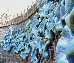 synergy ceramic wall sculpture by michelle maher 25 pcs 8 500 00 3 4 x 1m sculpture in context glass art products ceramic wall sculpture blown glass art