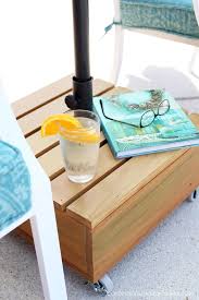 Umbrella outdoor patio side tables. Outdoor Rolling Umbrella Coffee Table Base By Confessions Of A Serial Diyer Featured On Funky Jun Diy Umbrella Base Patio Umbrellas Diy Outdoor Umbrella Stand