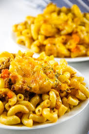 Macaroni pasta in tomato sauce with spoon wood on a wooden table. Cheesy Macaroni Pasta Bake The Bitter Side Of Sweet