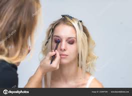 professional makeup artist works