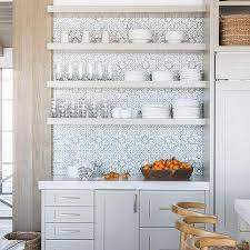 Remove and reposition the tile stencil below the first painted repeat and continue stenciling your backsplash. White And Blue Mosaic Hand Painted Kitchen Backsplash Tiles Design Ideas