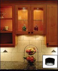The antique white paneled kitchen cabinets and glass framed display cabinets in this antique style kitchen match well with the small sandstone tiled backsplash and larger random coursed sandstone floor tiles. 14 Cabinet Lighting Ideas Cabinet Lighting Glass Cabinet Cabinet