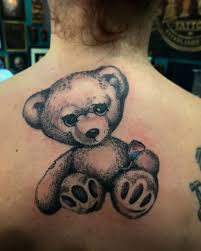 Angry teddy bear hold cat tattoo for women. Updated 40 Mighty Bear Tattoos March 2020