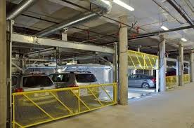 The puzzle parking system is a car parking system with a mechanical device that multiplies parking capacity inside a parking lot. A Guide To Puzzle Parking Systems Harding Steel Parking Solutions