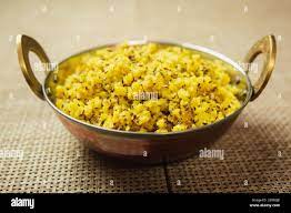 Suji Poha,Semolina Poha recipe cooked in Nepali Style served in a pot. Suji  ko puwa Stock Photo - Alamy