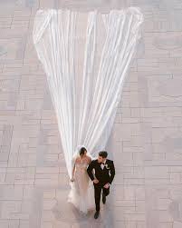 The Story Behind Priyanka Chopra S Wedding Gown A 75 Ft Long Veil Embroidered Names Her Reaction And More Nick jonas, 26, and priyanka chopra's, 36, first official wedding photos have been unveiled, showing the happy couple priyanka chopra stuns in a red lehenga and white ralph lauren gown decorated with two million pearl sequins and a 75ft veil as she and nick jonas unveil first official shots. the story behind priyanka chopra s
