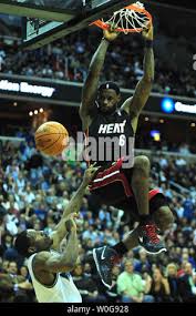 Miami Heat's LeBron James dunks the ball over Washington Wizards' Othyus  Jeffers at the Verizon Center in Washington