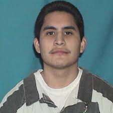 Man charged in murder that renews questions about justice system