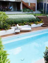 Hot tub enclosed in a stone cave. Pool Garden Design Think Outside Gardens