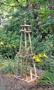 Lay 2 2x2x8 on the ground in a triangle shape. Create A Diy Wooden Garden Obelisk Chatfield Court