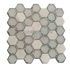 The individual tiles are cut by a waterjet process. Carrara White Stone Blend Glass Hexagon Mosaic Tiles Splashback Glass Mosaic Tile Product Huagui Mosaic Tile