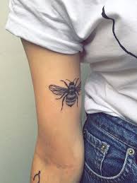 Find and save ideas about bumblebee tattoo photo on tattoos book. Upper Arm Bumblebee Tattoo Arm Tattoos For Women Tattoos Simple Arm Tattoos