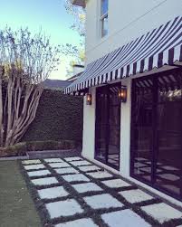 Black And White Striped Outdoor Awnings Our Sweet New Client Moved Into The Cutest House With The Chicest Black And White Striped Awnings Obsessed Palomacontrer Cute House Pergola Pergola Shade