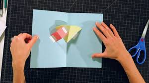 You can use it to move a piece side to side across the face of the card, or to pop something in or out from the fold of the card. How To Make Layers On A V Fold On A Pop Up Card Howcast